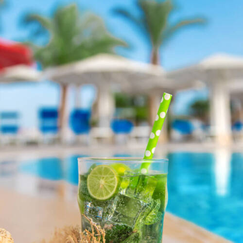 Mojito cocktail by the pool. Selective focus. Drink.